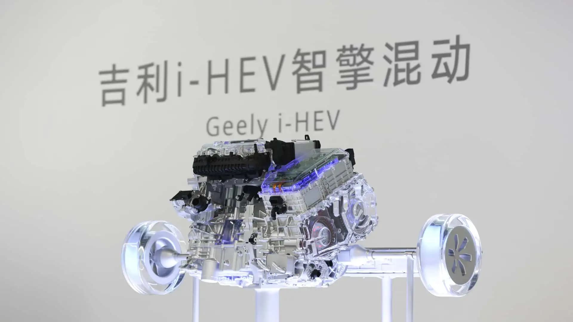 A high-tech Geely i-HEV engine unit on display showing its compact and complex hybrid architecture