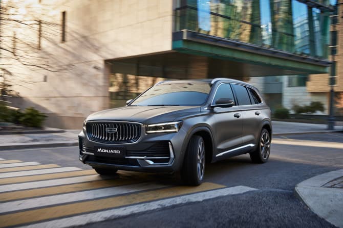 A Geely Monjaro SUV driving on a road, showcasing the brand's latest hybrid-ready models