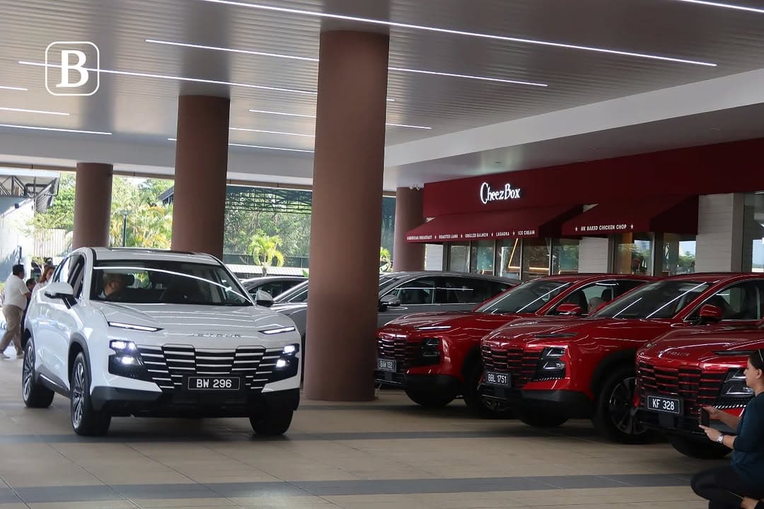 A large row of colorful Jetour Dashing SUVs parked at Setia Point during the mass delivery ceremony